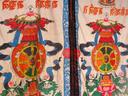 Looking out from inside a monastery temple through the door hangings.